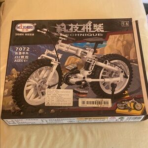Winner! Plastic toy mountain bike building kit w/real rubber tires. Ages 6+